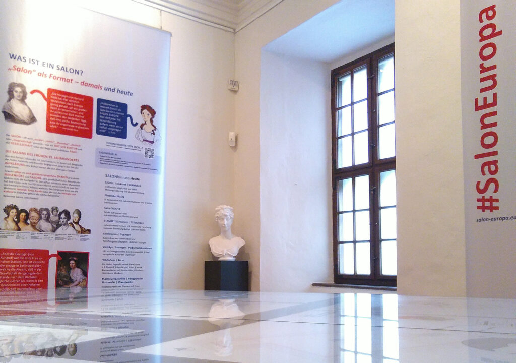 Exhibition banners and in the middle a bust of Dorothea o Courland